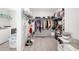Spacious walk-in closet with shelving and racks to maximize organization and storage capacity at 5644 Flagstone Trl, Palmetto, FL 34221