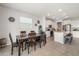Dining area featuring a wooden table with seating, modern decor, and tile floors at 5644 Flagstone Trl, Palmetto, FL 34221