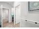 Hallway view with access to the pantry and other rooms at 5644 Flagstone Trl, Palmetto, FL 34221