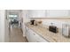Bright kitchen with white cabinetry, granite countertops, and stainless steel appliances at 5644 Flagstone Trl, Palmetto, FL 34221
