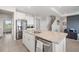 Open kitchen area featuring an island and stainless steel appliances at 5644 Flagstone Trl, Palmetto, FL 34221
