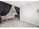 Spacious main bedroom featuring elegant decor and ample natural light at 5644 Flagstone Trl, Palmetto, FL 34221
