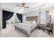 Bright and airy main bedroom with tray ceiling, fan, and elegant décor at 5644 Flagstone Trl, Palmetto, FL 34221