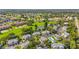 An elevated shot shows golf course and surrounding residential area, plus community pool for some of the nearby homes at 6310 Green Oak Cir, Bradenton, FL 34203
