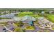 Aerial view of the community clubhouse with golf course and water features at 6310 Green Oak Cir, Bradenton, FL 34203