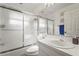 Bathroom featuring a shower with frosted glass doors, vanity and mirror at 6310 Green Oak Cir, Bradenton, FL 34203