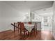 Open dining room with hardwood floors connecting to a modern kitchen at 6310 Green Oak Cir, Bradenton, FL 34203