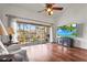 Bright living room with hardwood floors, high ceilings and a screened lanai at 6310 Green Oak Cir, Bradenton, FL 34203