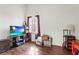 Living room with hardwood floors and a flat screen television at 6310 Green Oak Cir, Bradenton, FL 34203