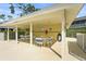 Pool cabana featuring seating around several tables, perfect for relaxing and enjoying the shade and pool at 6310 Green Oak Cir, Bradenton, FL 34203