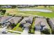 Birds eye view of well maintained homes, manicured lawns and landscaping plus neighborhood lake at 6377 Mighty Eagle Way, Sarasota, FL 34241