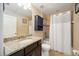 Nicely appointed bathroom with granite countertops, a shower with bathtub, and vanity at 6377 Mighty Eagle Way, Sarasota, FL 34241