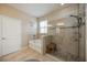 Main bathroom featuring a separate tub and shower, a pebble floor shower and natural light at 6377 Mighty Eagle Way, Sarasota, FL 34241