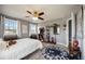 Bedroom features carpet floors, bright windows, closet, ceiling fan, and natural light at 6377 Mighty Eagle Way, Sarasota, FL 34241