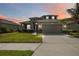 Charming two-story home features a well-manicured lawn and a spacious two-car garage at 6377 Mighty Eagle Way, Sarasota, FL 34241