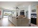 Living room with gray sectional sofa, sliding glass doors to patio, and fish tank at 6377 Mighty Eagle Way, Sarasota, FL 34241