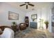 Inviting living room featuring a ceiling fan, stylish furnishings, and neutral-toned decor at 6377 Mighty Eagle Way, Sarasota, FL 34241