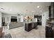 Open-concept living space with kitchen, living room, and dining area at 6377 Mighty Eagle Way, Sarasota, FL 34241