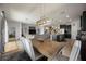 Open-concept living space with a large kitchen island, dining area, and comfortable seating at 6377 Mighty Eagle Way, Sarasota, FL 34241