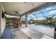 Relaxing screened-in patio with a dining area, a pool, and outdoor furniture for leisure at 6377 Mighty Eagle Way, Sarasota, FL 34241