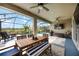 Inviting screened-in patio with outdoor dining and lounge areas near the pool at 6377 Mighty Eagle Way, Sarasota, FL 34241