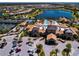 Aerial view of the community clubhouse, pool, tennis courts and surrounding homes at 6714 Alstead Cir, Bradenton, FL 34202