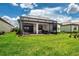 Lush backyard with a covered lanai that has brick pavers for outdoor living and entertaining at 6714 Alstead Cir, Bradenton, FL 34202