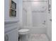Stylish bathroom featuring a shower-tub combo, white subway tile, and framed botanical artwork at 6714 Alstead Cir, Bradenton, FL 34202