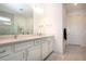 Bathroom with a double sink vanity and tiled floors and lots of natural light at 6714 Alstead Cir, Bradenton, FL 34202