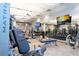 Well-equipped gym with a variety of modern fitness machines, weights, and TV screens for entertainment at 6714 Alstead Cir, Bradenton, FL 34202
