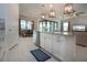 Spacious kitchen featuring an island, stainless appliances, and views into the living and dining areas at 6714 Alstead Cir, Bradenton, FL 34202