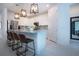 Well-lit kitchen featuring stainless steel appliances, pendant lighting, and an island with seating at 6714 Alstead Cir, Bradenton, FL 34202