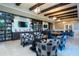 Clubhouse library with books, televisions, seating and a table at 6714 Alstead Cir, Bradenton, FL 34202