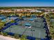 Aerial view of the tennis and pickleball courts and surrounding neighborhood at 6714 Alstead Cir, Bradenton, FL 34202