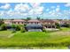 A view of the backyard, pool, and patio with screened enclosure, perfect for outdoor relaxation at 7020 Island Queen Ct, Sarasota, FL 34233