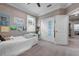 Comfortable bedroom with neutral carpet, sliding door closet, and light-colored walls at 7020 Island Queen Ct, Sarasota, FL 34233