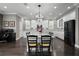Beautiful open kitchen featuring granite countertops, modern appliances, and dark hardwood floors at 7020 Island Queen Ct, Sarasota, FL 34233