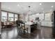 Bright kitchen with modern appliances, island seating, and a breakfast nook at 7020 Island Queen Ct, Sarasota, FL 34233