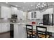 Open kitchen with stainless steel appliances, granite countertops, and a spacious kitchen island at 7020 Island Queen Ct, Sarasota, FL 34233