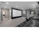 Home movie theater featuring comfortable seating and a large projection screen at 7020 Island Queen Ct, Sarasota, FL 34233