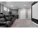 Home movie theater featuring comfortable seating, a large projection screen, and decorative ceiling lights at 7020 Island Queen Ct, Sarasota, FL 34233