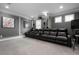 Home movie theater featuring comfortable seating and a large screen at 7020 Island Queen Ct, Sarasota, FL 34233