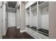 Mudroom with built-in storage, drawers, and bench at 7020 Island Queen Ct, Sarasota, FL 34233