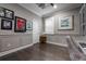 Office with decorative ceiling, built-in shelving, and wood floors at 7020 Island Queen Ct, Sarasota, FL 34233