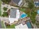 Amazing aerial view showcasing waterfront home featuring a uniquely shaped pool at 715 Fontana Ln, Bradenton, FL 34209