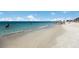 Beautiful white sand beach with people enjoying the warm weather at 715 Fontana Ln, Bradenton, FL 34209