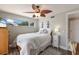 Bright bedroom with a ceiling fan, a window for natural light, and wood-look flooring at 715 Fontana Ln, Bradenton, FL 34209