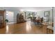 Spacious dining room with hardwood floors and view of the front yard, ideal for Gathering meals at 715 Fontana Ln, Bradenton, FL 34209