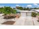 Charming home featuring a well-manicured front yard and a two-car garage at 715 Fontana Ln, Bradenton, FL 34209