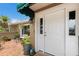 Inviting front porch with brick flooring and charming entrance leading to the home at 715 Fontana Ln, Bradenton, FL 34209